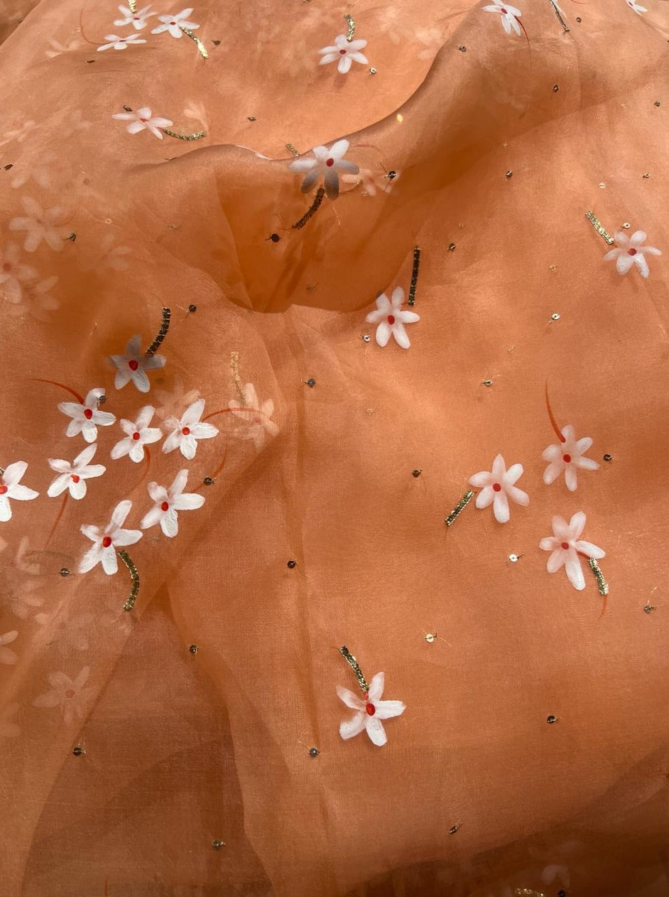 Parijat Flowers on Rusty Orange Organza saree with Sequins