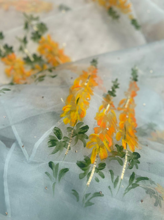 Yellow Popsicles on powder blue organza saree