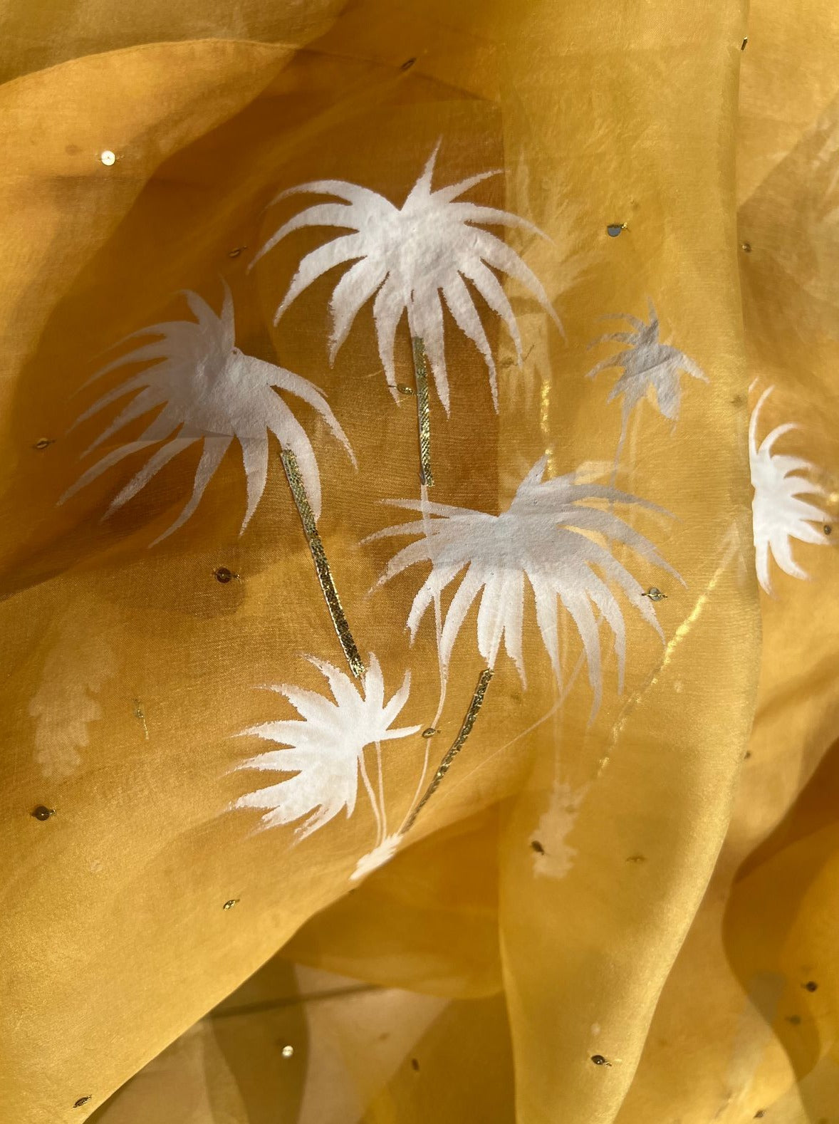 Palm trees on haldi yellow organza saree