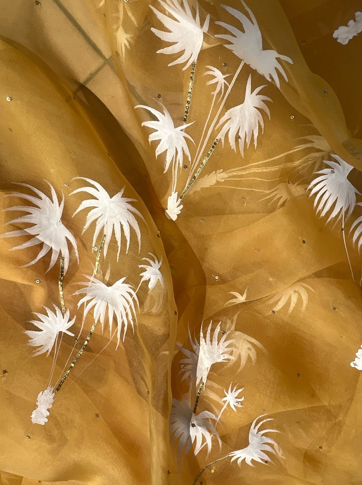 Palm trees on haldi yellow organza saree