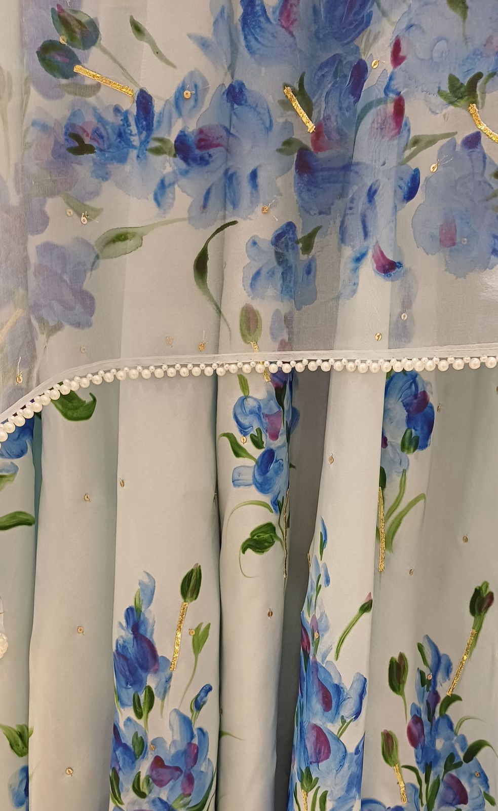 Muscats flowers on powder blue silk flared kurta , organza duppata with pearl border & sitaras