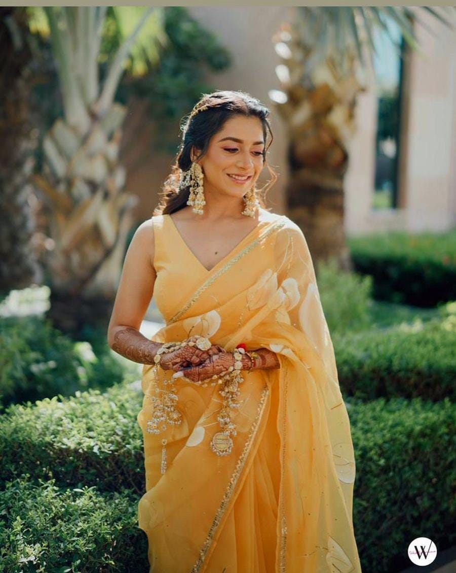 Flamingo's on Haldi Yellow organza saree with Sequins Border