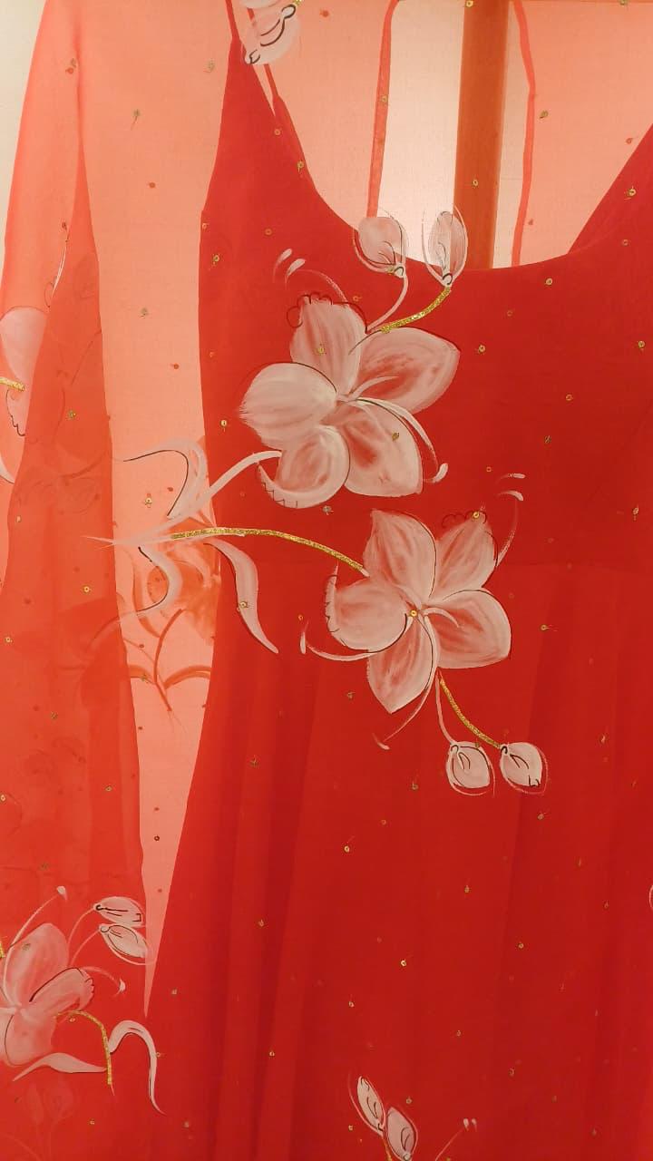 Lilies on red organza duppata with Sitara’s paired with a silk plain flared kurta with Sitara’s