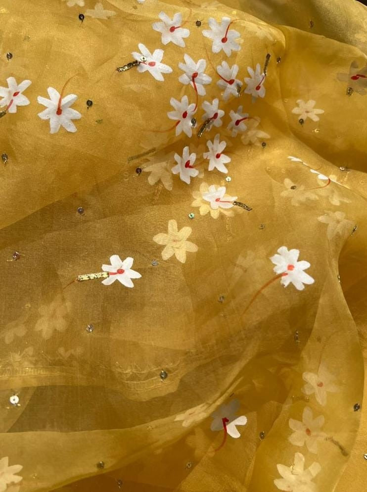 Parijat flowers on Haldi Yellow Organza Saree with border