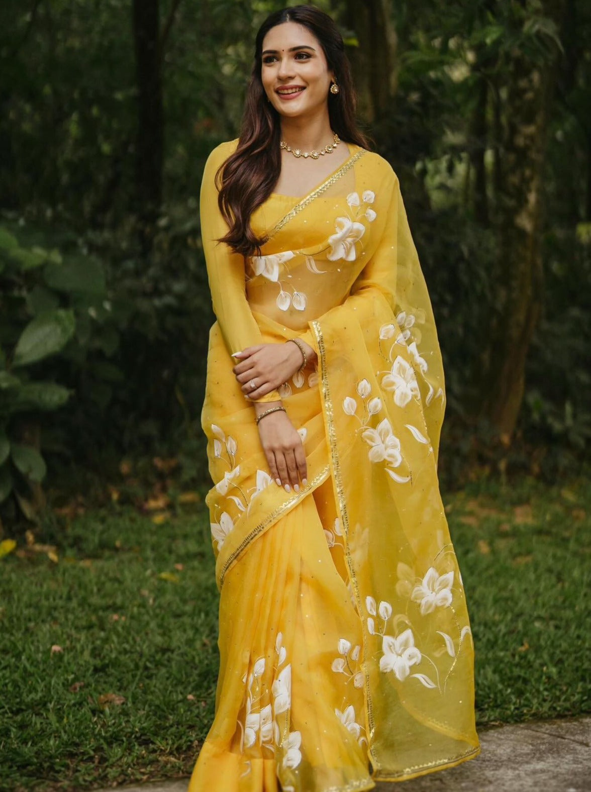 Lilies on Haldi Yellow organza saree with Sequins