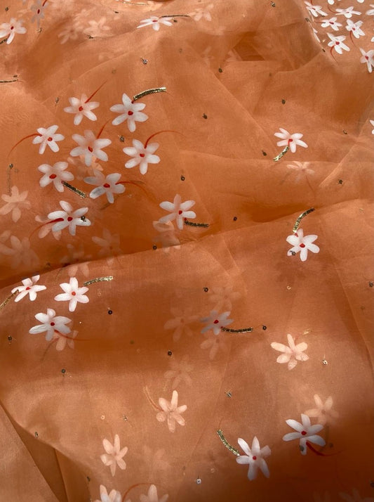 Parijat Flowers on Rusty Orange Organza saree with Sequins