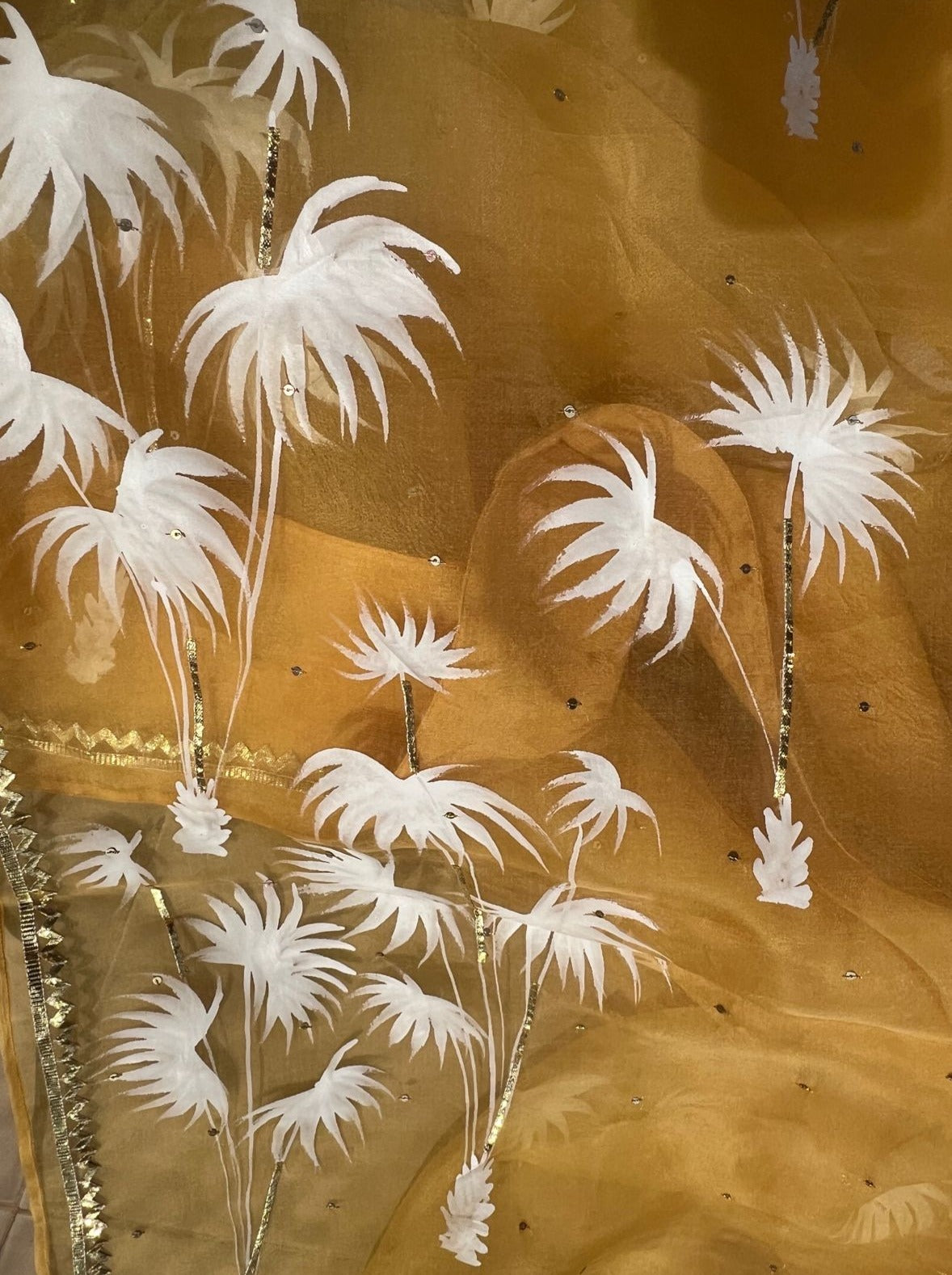 Palm trees on haldi yellow organza saree