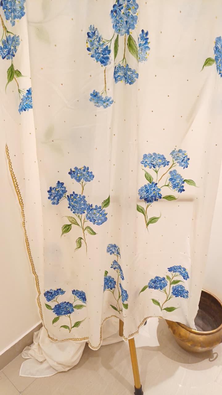 Blue hydrangeas on ivory pure silk saree with Sitara’s & border