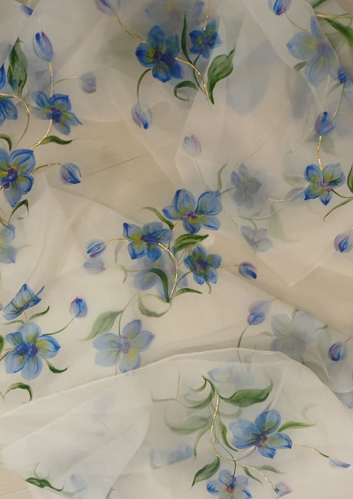 Blue orchids on dull ivory organza saree