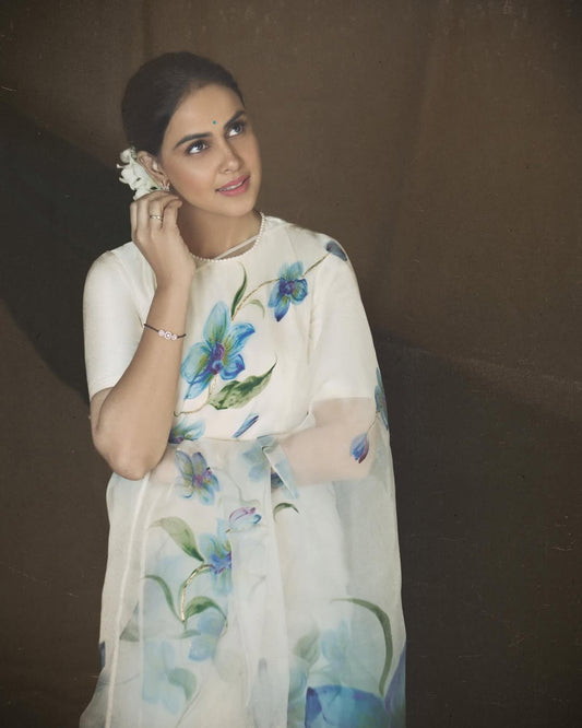 Blue orchids on dull ivory organza saree