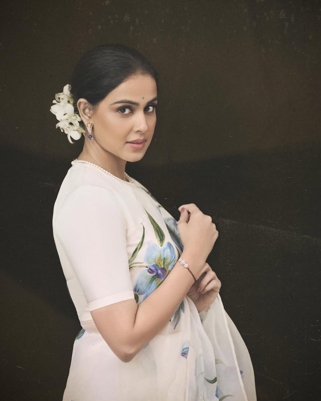 Blue orchids on dull ivory organza saree