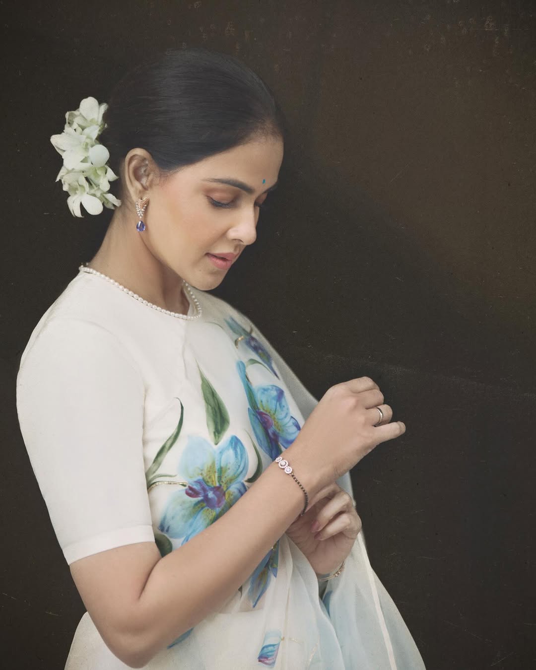 Blue orchids on dull ivory organza saree