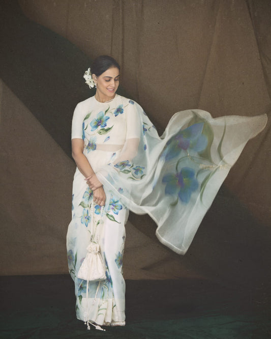 Blue orchids on dull ivory organza saree