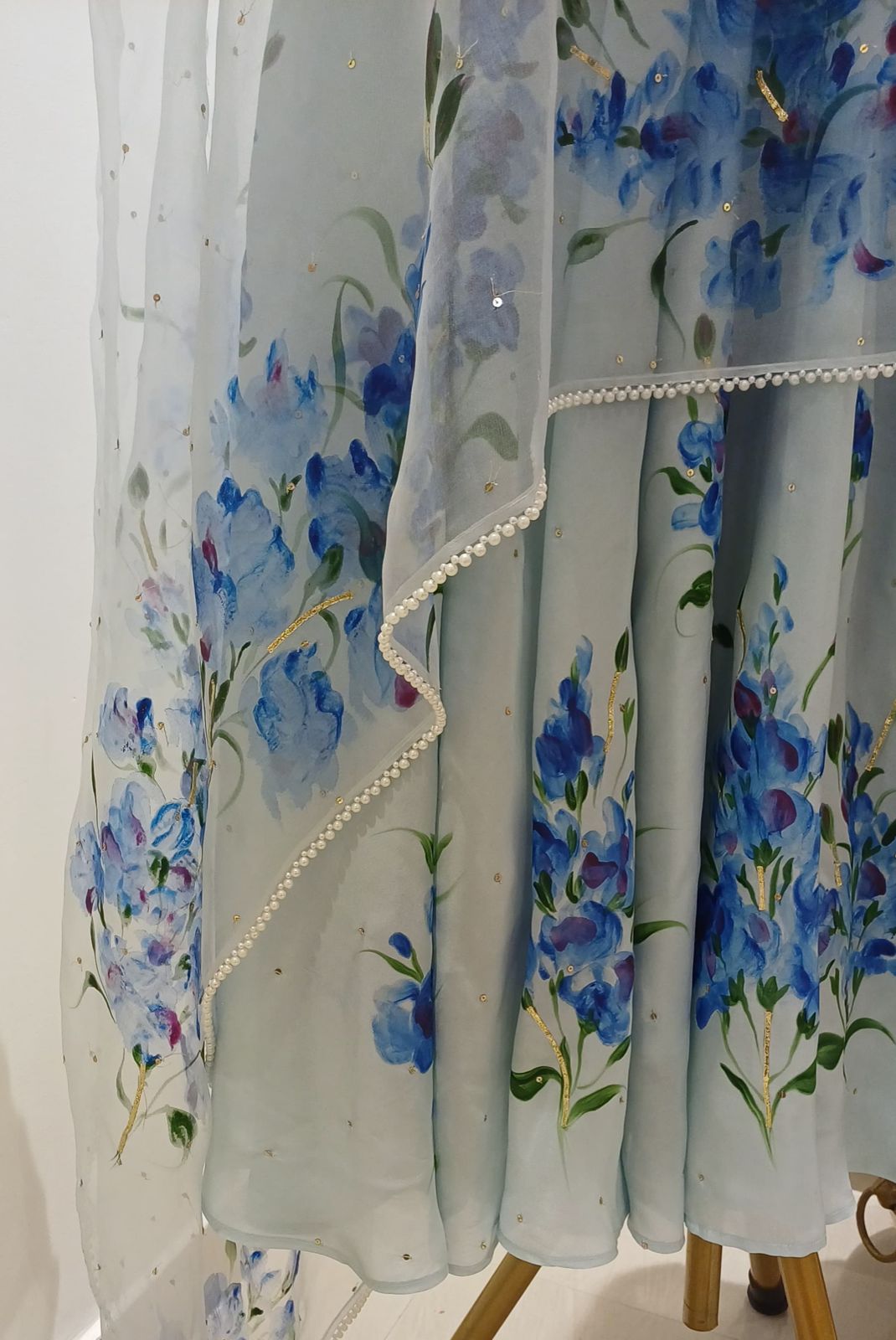 Muscats flowers on powder blue silk flaired kurta , organza duppata with pearl border & sitaras