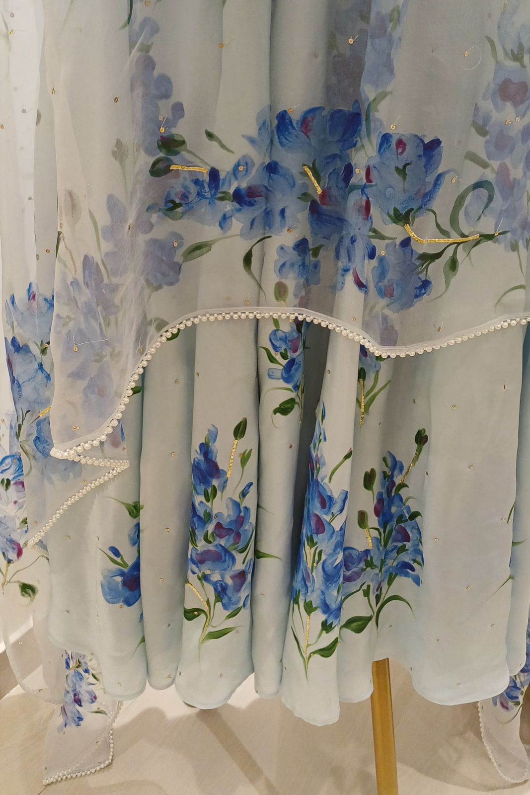Muscats flowers on powder blue silk flaired kurta , organza duppata with pearl border & sitaras